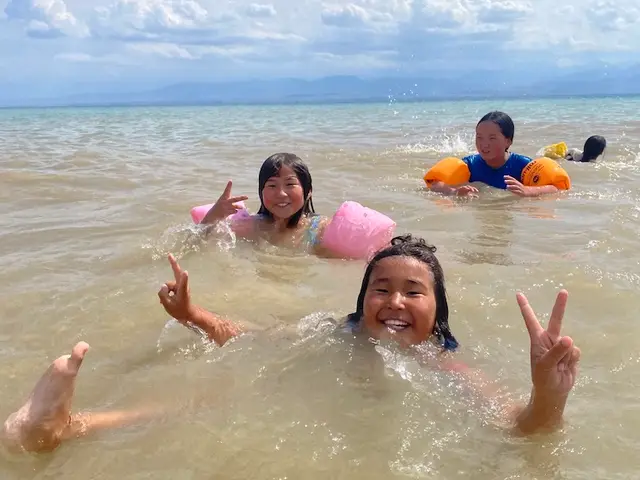 Children swimming and laughing