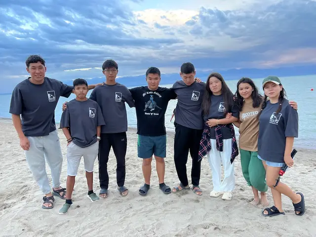 Youth arm in arm on the shore